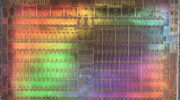 Abstract microscopic photography of a Graphics Processing Unit in rainbow colors.