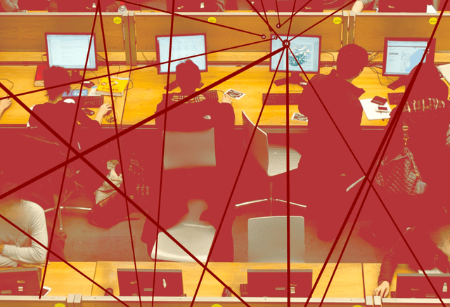 A computer lab with three rows of four desks, each occupied by students working at computers. Overlaying the computer lab are red lines connecting through nodes, symbolizing the flow of communication, data exchange, and interconnected networks.